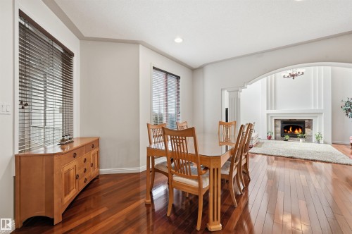 2423 Tegler Green, Edmonton, AB - Indoor Photo Showing Dining Room With Fireplace