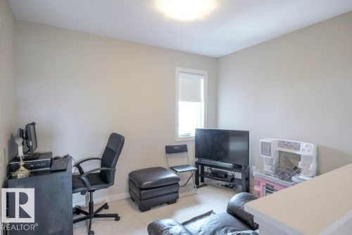 Neutral wall paint, recessed lighting, and carpeted flooring - 16619 14 Avenue, Edmonton, AB - Indoor Photo Showing Office