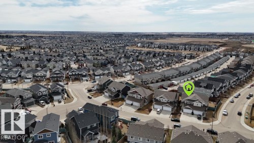 Aerial perspective showcasing a residential neighborhood with detached homes and townhomes - 16619 14 Avenue, Edmonton, AB - Outdoor With View