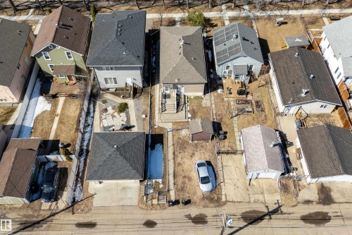 Aerial property overview featuring multiple residential structures and paved road frontage - 11919 96 Street, Edmonton, AB - Outdoor