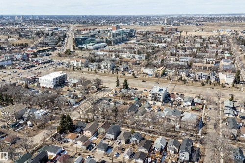 Aerial perspective showcasing an urban landscape with a mix of residential and commercial structures - 11919 96 Street, Edmonton, AB - Outdoor With View