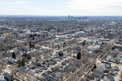 Expansive aerial capturing a widespread urban residential area with numerous detached properties - 