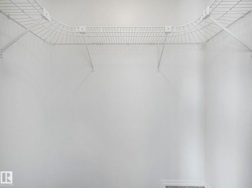 Closet featuring a white wire shelving system - 14 15128 22 Street, Edmonton, AB - Indoor With Storage