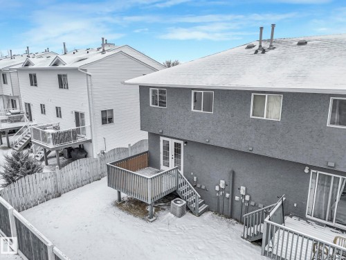 The property features a private deck and a fenced yard - 14 15128 22 Street, Edmonton, AB - Outdoor With Deck Patio Veranda With Exterior