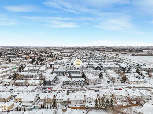 Aerial view showcasing the residential neighborhood with snow-covered rooftops and streets - 14 15128 22 Street, Edmonton, AB - Outdoor With View