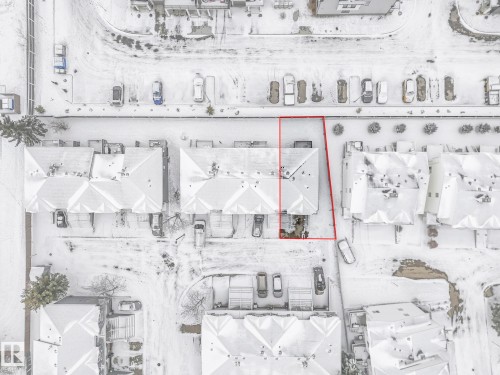 Aerial view of the property with a red outline, showcasing the roof and parking area - 14 15128 22 Street, Edmonton, AB - Other