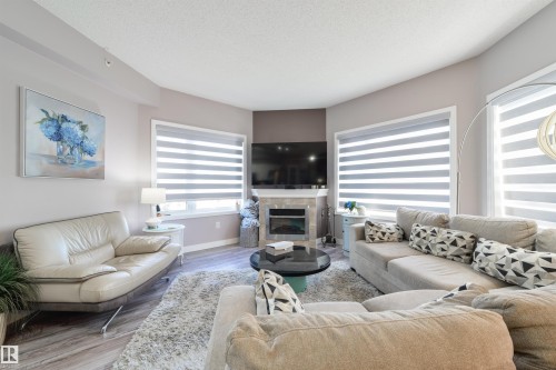 306 8931 156 Street, Edmonton, AB - Indoor Photo Showing Living Room With Fireplace