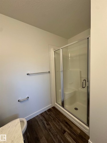 Main Bathroom upstairs with walk in shower and seat.  *pictures don't represent exact colours and are from another home with same layout - 65 5122 213A Street, Edmonton, AB - Indoor Photo Showing Bathroom