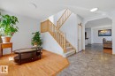 Staircase featuring wood railings and carpeted treads - 9904 144 Avenue, Edmonton, AB  - Indoor Photo Showing Other Room 