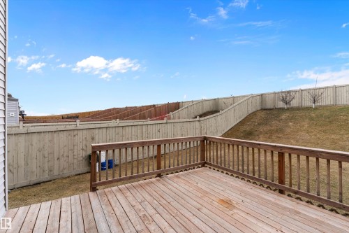Expansive wooden deck featuring sturdy railings and a slatted surface - 3314 9 Street Nw, Edmonton, AB - Outdoor With Exterior