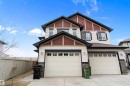Two-story residence featuring light-colored siding with dark trim accents - 3314 9 Street Nw, Edmonton, AB  - Outdoor 