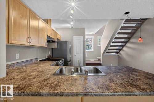 130 5604 199 Street, Edmonton, AB - Indoor Photo Showing Kitchen With Double Sink
