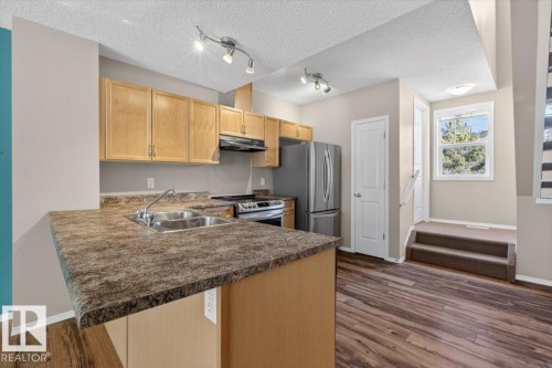 130 5604 199 Street, Edmonton, AB - Indoor Photo Showing Kitchen With Double Sink