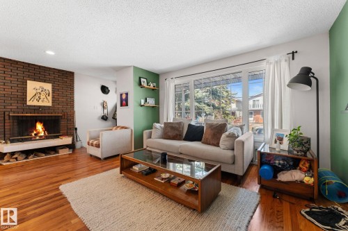 8759 92 Avenue, Edmonton, AB - Indoor Photo Showing Living Room With Fireplace