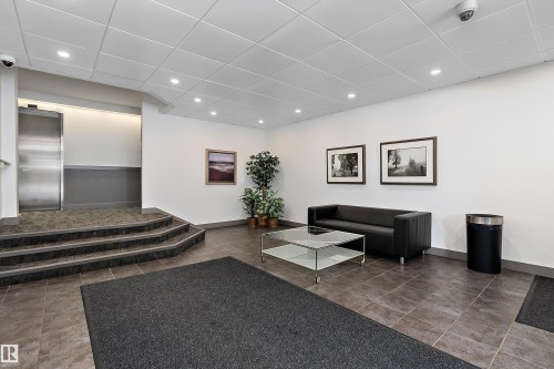 Lobby featuring durable tile flooring, recessed lighting, and a stainless steel elevator - 206 9929 113 Street, Edmonton, AB - Indoor Photo Showing Other Room