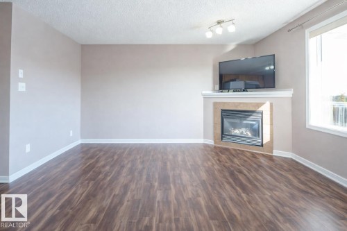 2887 23 Street Nw, Edmonton, AB - Indoor Photo Showing Other Room With Fireplace