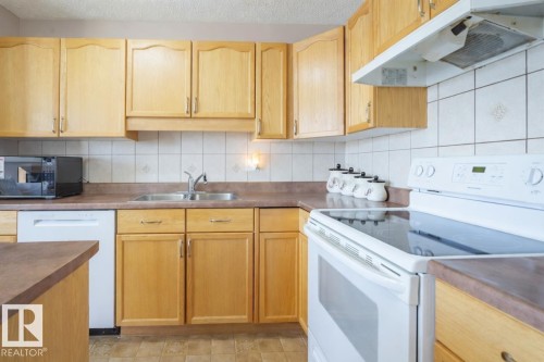 2887 23 Street Nw, Edmonton, AB - Indoor Photo Showing Kitchen With Double Sink