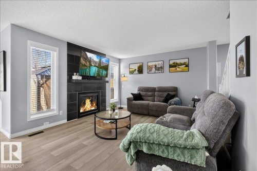 55 Silverstone Drive, Stony Plain, AB - Indoor Photo Showing Living Room With Fireplace