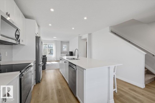 2418 Trumpeter Way, Edmonton, AB - Indoor Photo Showing Kitchen With Upgraded Kitchen