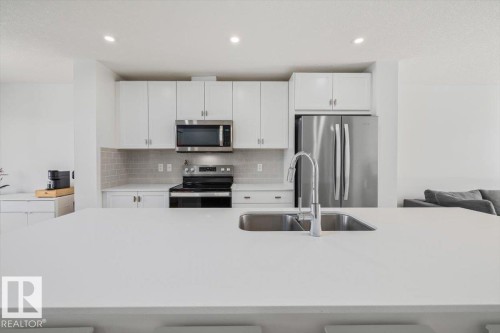 2418 Trumpeter Way, Edmonton, AB - Indoor Photo Showing Kitchen With Double Sink With Upgraded Kitchen