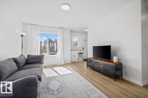 2418 Trumpeter Way, Edmonton, AB - Indoor Photo Showing Living Room