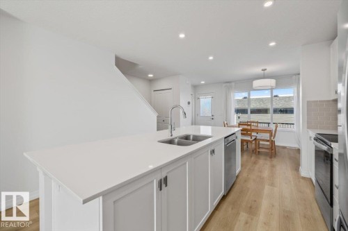 2418 Trumpeter Way, Edmonton, AB - Indoor Photo Showing Kitchen With Double Sink