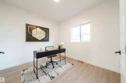 Office with light wood-type flooring - 