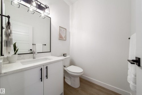 Half bathroom with vanity and dark wood-style flooring - 33 Sun Meadows Cl, Stony Plain, AB - Indoor Photo Showing Bathroom