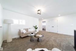 Living area with carpet flooring and recessed lighting - 