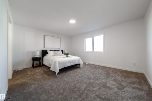 Carpeted bedroom with baseboards - 33 Sun Meadows Cl, Stony Plain, AB - Indoor Photo Showing Bedroom