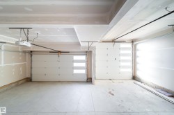 Garage featuring a garage door opener - 