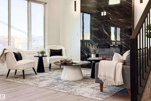 Sitting room featuring wood finished floors and baseboards - 33 Sun Meadows Cl, Stony Plain, AB - Indoor Photo Showing Other Room