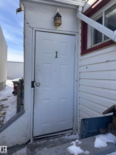 White paneled entry door with numerical designation - 10528 100 Avenue, Westlock, AB - Outdoor With Exterior