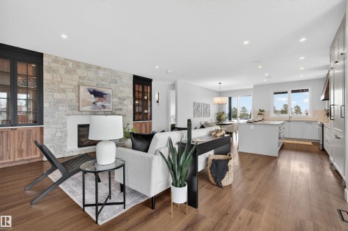 Open-concept living space with wood-finish flooring throughout - 149 Eastgate Way, St. Albert, AB - Indoor