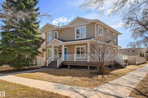 Two-story residence featuring light brown siding and white trim - 11539 75 Avenue, Edmonton, AB - Outdoor