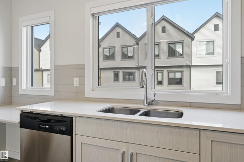 77 1010 Rabbit Hill Road, Edmonton, AB - Indoor Photo Showing Kitchen With Double Sink