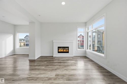 77 1010 Rabbit Hill Road, Edmonton, AB - Indoor Photo Showing Living Room With Fireplace