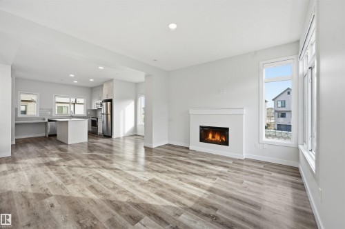 77 1010 Rabbit Hill Road, Edmonton, AB - Indoor Photo Showing Living Room With Fireplace