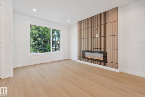 Edmonton, AB - Indoor Photo Showing Living Room With Fireplace