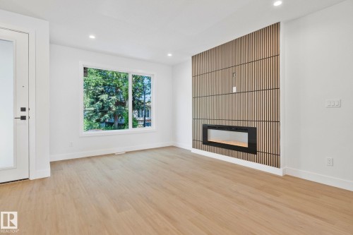 Edmonton, AB - Indoor Photo Showing Living Room With Fireplace