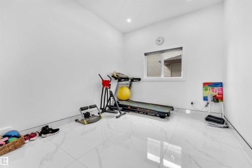 8118 Orchards Green, Edmonton, AB - Indoor Photo Showing Gym Room