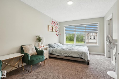 This room features light grey walls and light brown carpet flooring - 6260 175 Avenue, Edmonton, AB - Indoor Photo Showing Bedroom