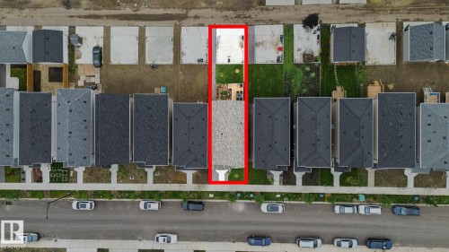 Aerial view of the property, featuring a roof with dark shingles and a backyard with a grass lawn - 6260 175 Avenue, Edmonton, AB - Other