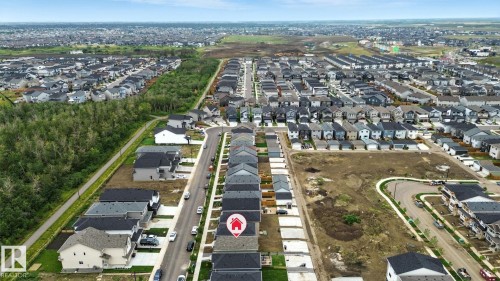 Aerial view of the community, showcasing residential properties and undeveloped land - 6260 175 Avenue, Edmonton, AB - Outdoor With View