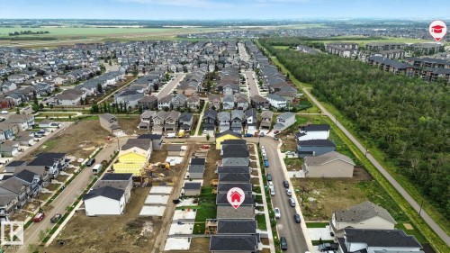 Aerial view of a residential neighborhood featuring established homes and properties currently under construction - 6260 175 Avenue, Edmonton, AB - Outdoor With View