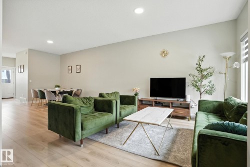 Living area featuring light-colored flooring, neutral wall paint, and recessed lighting - 6260 175 Avenue, Edmonton, AB - Indoor Photo Showing Living Room