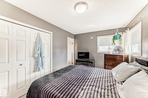 Interior room featuring neutral gray walls, white trim, and a textured ceiling - 9845 184 Street, Edmonton, AB - Indoor Photo Showing Bedroom