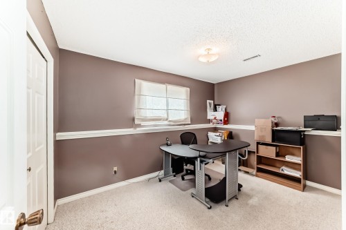Versatile room featuring neutral-toned walls, white trim, and light-colored carpeting - 9845 184 Street, Edmonton, AB - Indoor Photo Showing Other Room