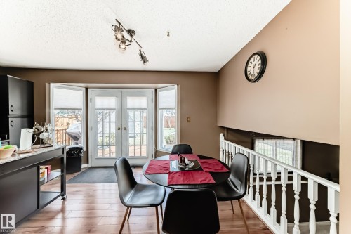 Wood-finish flooring throughout - 9845 184 Street, Edmonton, AB - Indoor Photo Showing Dining Room