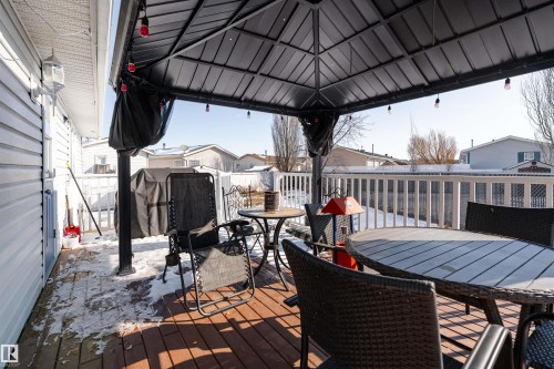 The property features a spacious wooden deck with a gazebo, providing an inviting outdoor living area - 1663 Jubilee Crescent, Sherwood Park, AB - Outdoor With Deck Patio Veranda With Exterior